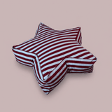 Star-shaped floor cushion for kids featuring bold vertical light blue, burgundy, and white stripes. Large Superstar Crash Pad on a neutral studio background.